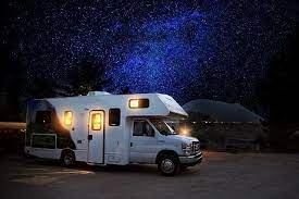 Motorhome RV in a sky full of stars