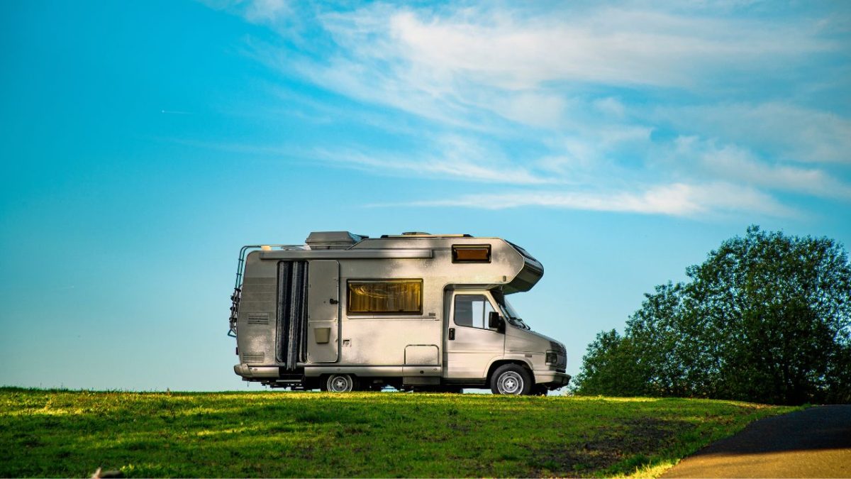 closeup shot of a camper van parked in the green