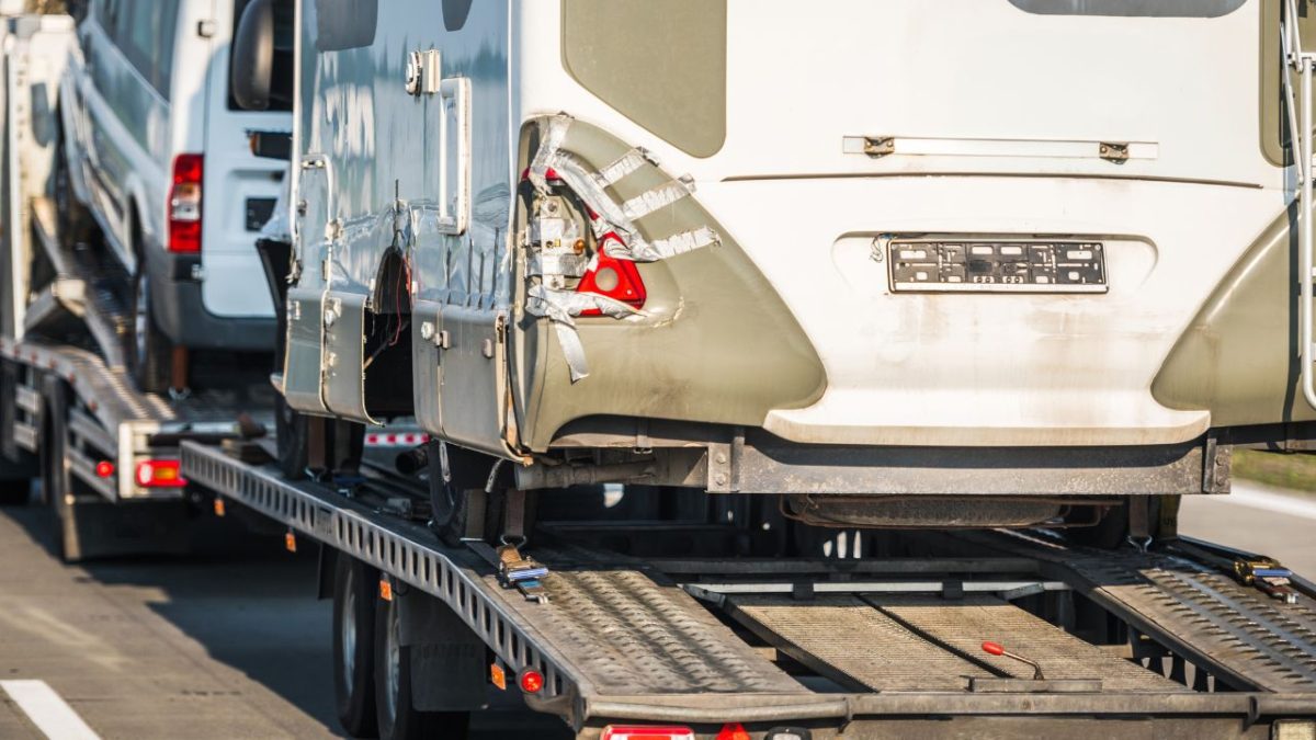 damaged camper vans rv towed away to a repair shop